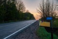 A hazy sunrise over a country road