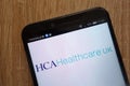 HCA Healthcare UK logo displayed on a modern smartphone