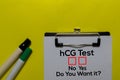 HCG Test, Do You Want it? Yes or No. On office desk background