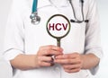 HCV test analysis. Magnifying glass in doctors hand