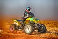 HD- Quad Bike kicking up trail of dust on sand track during rall