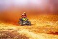 HD- Quad Bike kicking up trail of dust on sand track during rall