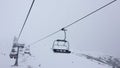 1080 HD hyper lapse video clip of four person ski chair lift on a misty mountain