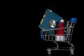 HDD and Santa Claus hat in a shopping trolley. The concept of New Year gifts and Christmas discounts on computer accessories. Royalty Free Stock Photo