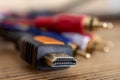 HDMI cable  and analog audio video cable on old wood background Royalty Free Stock Photo