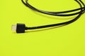 HDMI cable on bright green background Royalty Free Stock Photo
