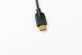 HDMI cable with gold plated connectors on white background Royalty Free Stock Photo