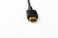 HDMI cable with gold plated connectors on white background Royalty Free Stock Photo