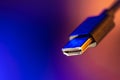 Hdmi plug in focus on blue copyspace. Neon connection. Royalty Free Stock Photo