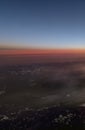 HDR Aerial photo of the landscape with clouds, mountains and landscape with snowy patches during sunset Royalty Free Stock Photo