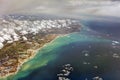 HDR Aerial photo of the landscape and coastline with clouds, snowy mountains and view stretching all the way to the horizon