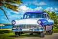 HDR - American blue classic car parked on the Malecon near the beach in Havana Cuba - Serie Cuba Reportage