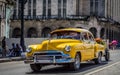 HDR - Beautiful american yellow vintage car drived in Havana Cuba - Serie Cuba Reportage Royalty Free Stock Photo