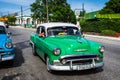 HDR beautiful green vintage car on the street in Cuba