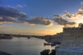 HDR colorful vivid sunset photo over historic Valletta city cityscape