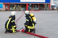 HDR - firefighter in action with waterhose Royalty Free Stock Photo