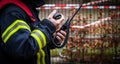 HDR - Firefighter operate with a walkie talkie in action - Serie Firefighter Royalty Free Stock Photo