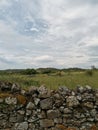 occitanie stormy sky above a stone wall