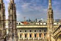 HDR photo of the white marble statues of Cathedral Duomo di Milano on piazza, Milan cityscape Royalty Free Stock Photo