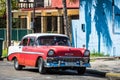 HDR red classic car with white roof in Varadero Cuba