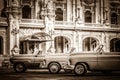 HDR - Street life with parked american convertible vintage cars before the gran teatro in Havana Cub