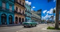 HDR - Street life scene in Havana Cuba with green american vintage cars - Serie Cuba Reportage Royalty Free Stock Photo