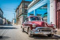 HDR - Wine red american vintage car parked on the street in Havana Cuba Royalty Free Stock Photo