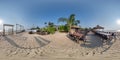 360 hdri panorama with coconut trees on ocean coast near tropical shack or open cafe on beach with swing in equirectangular Royalty Free Stock Photo