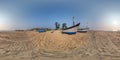 360 hdri panorama near old fishing boats in sand on ocean or sea at sunset in equirectangular spherical seamless projection Royalty Free Stock Photo