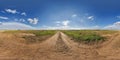 hdri 360 panorama view on gravel country roads among fields with clouds in sky in equirectangular full seamless spherical Royalty Free Stock Photo