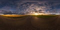 Hdri seamless spherical 360 panorama on asphalt road among fields in summer evening sunset with awesome clouds in equirectangular Royalty Free Stock Photo