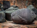The head of the ancient Buddha piled up with the remains of the Buddha that has decayed over the past 500 years old Royalty Free Stock Photo