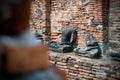 The head of the ancient Buddha piled up with the remains of the Buddha that has decayed over the past 500 years old Royalty Free Stock Photo