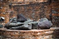 The head of the ancient Buddha piled up with the remains of the Buddha that has decayed over the past 500 years old Royalty Free Stock Photo