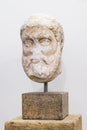 Head of ancient greek statue, bust on white wall Royalty Free Stock Photo