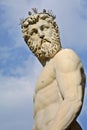 The head and body of Neptune against a blue sky Royalty Free Stock Photo