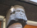 Head of a brick mason or bricklayer near a frontdoor in Amsterdam
