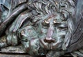 Head of a bronze lion. bronze sculpture of a sleeping lion on the monument of glory in Poltava, Ukraine