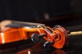 Head of brown vintage violin lying on a table