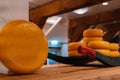 The head of cheese on the shelves of warehouse in netherlands open sky museum Zaanse schans. Production of Dutch cheese