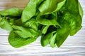 Head of fresh butter lettuce in a white bowl on a wood background Royalty Free Stock Photo