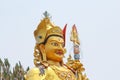 Head of golden Guru Rinpoche statue