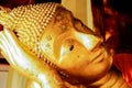 Head of golden reclining Buddha Image Royalty Free Stock Photo