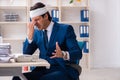 The head injured male employee working in the office Royalty Free Stock Photo