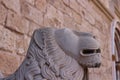 The head of the lion sculpture against the wall of the Almudaina Palace. Palma de Mallorca. Majorca. Spain