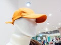 Head of a male mannequin in a red cap on the background of the store Royalty Free Stock Photo