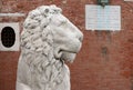 The head of a marble lion at the main entrance to the Venetian Arsenal. Italy Royalty Free Stock Photo