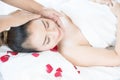 Head massage spa helps to relax. Asian woman receiving head massage in spa wellness center Royalty Free Stock Photo