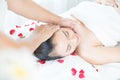 Head massage spa helps to relax. Asian woman receiving head massage in spa wellness center Royalty Free Stock Photo