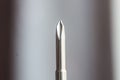 Head of metal crosses screwdriver close-up on a blurred background. hand tool close up. copy space Royalty Free Stock Photo